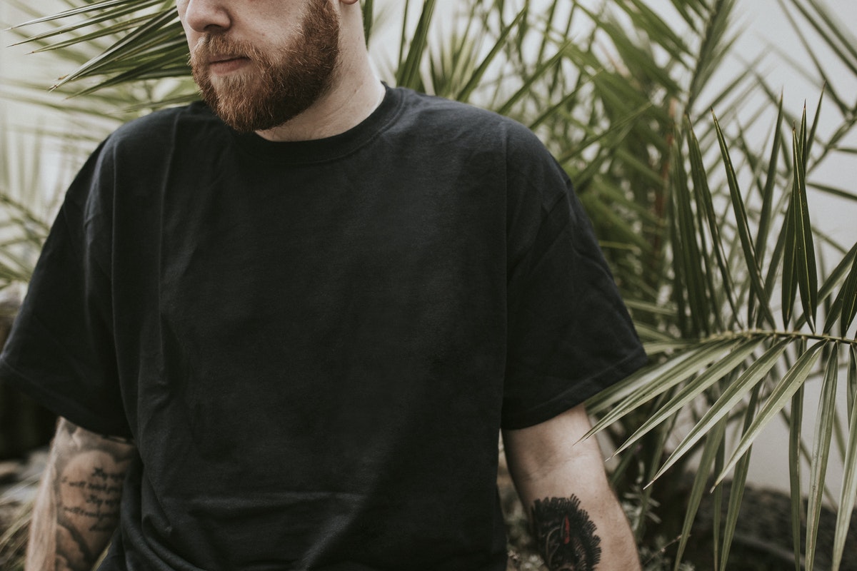 man-standing-in-front-of-plants-Valiant-Living-Recovery