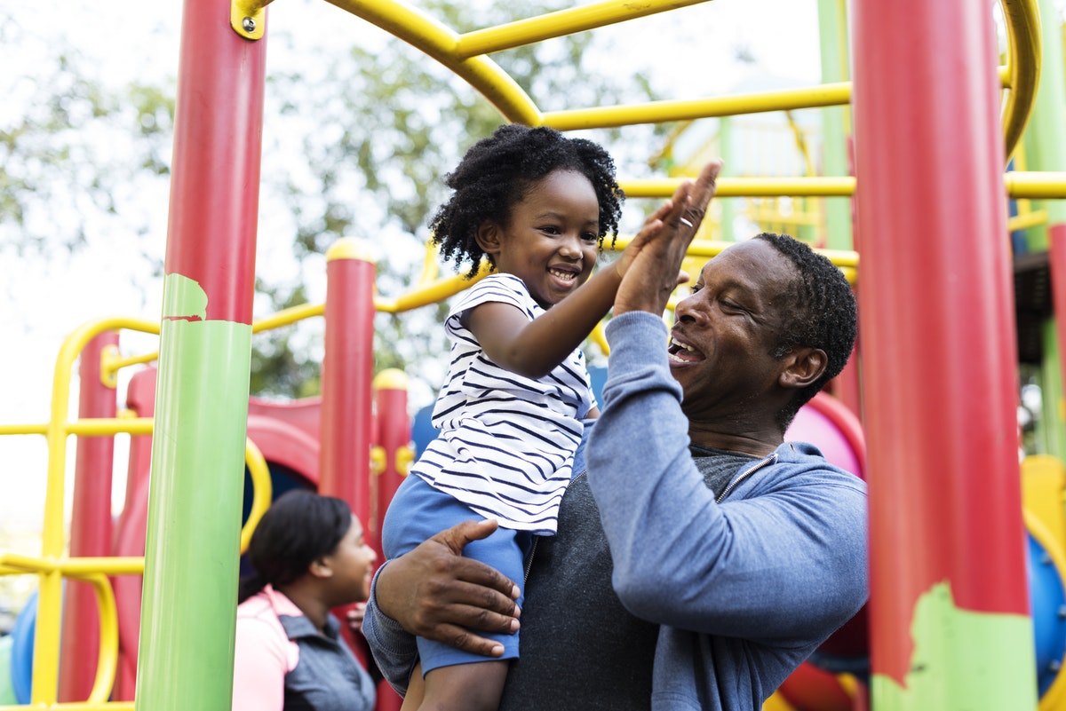 father and child on a park