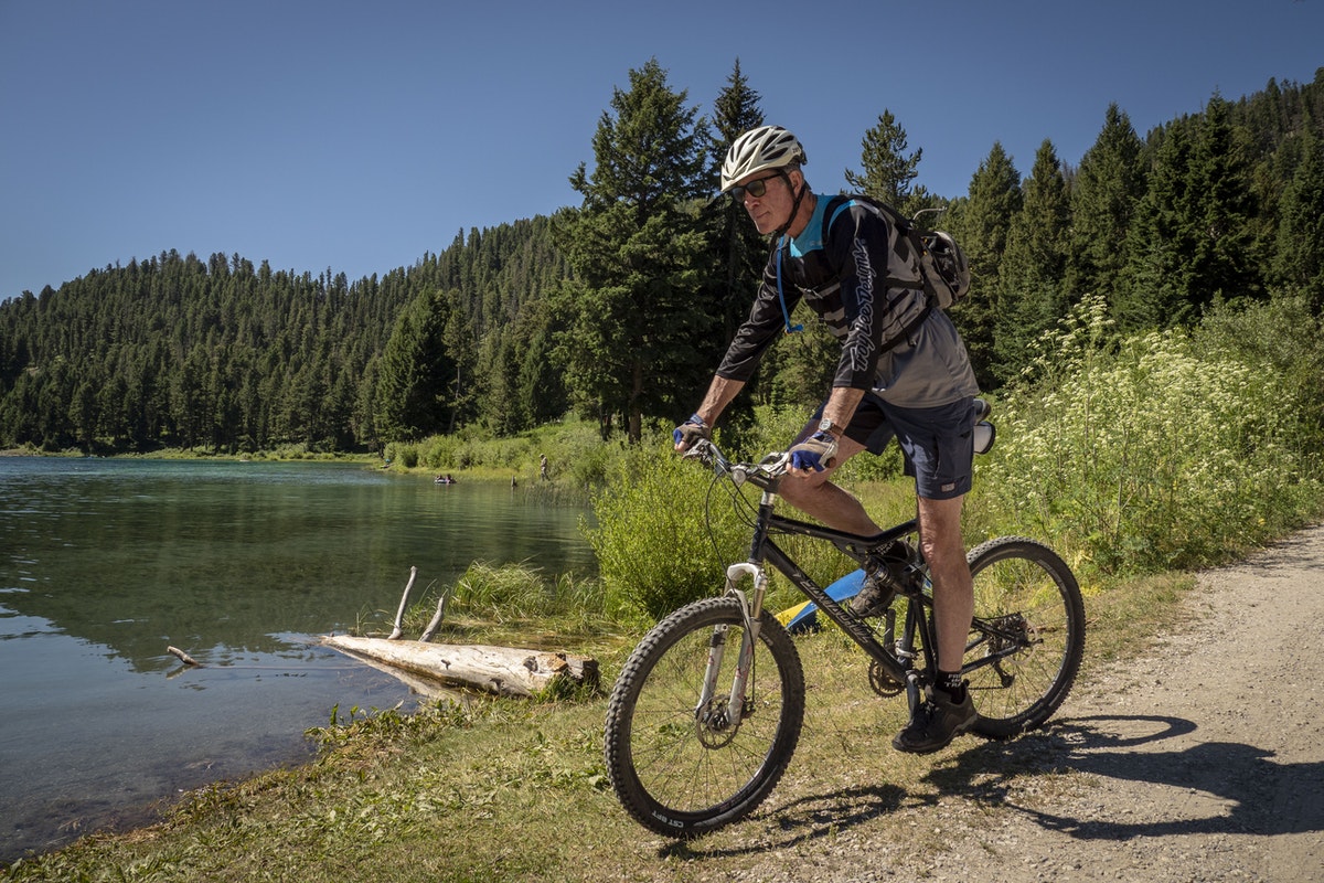 A man mountain bikes near Wade Lake in the Beaverhead-Deerlodge National Forest.