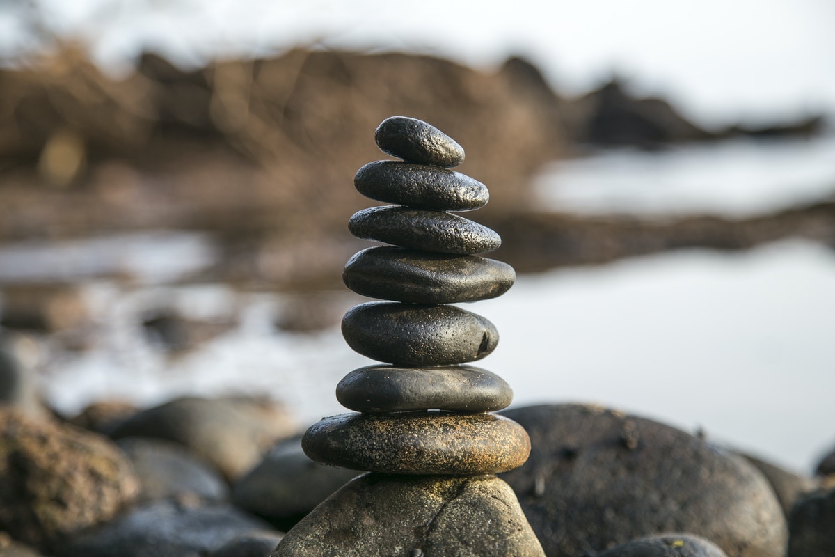 work-life-balance-beach-pebbles-balanced-on-top-of-one-another