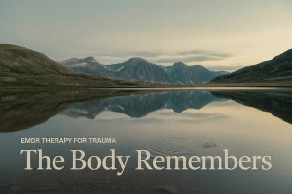 Scenic mountain lake reflecting recovery and healing for men's addiction treatment.