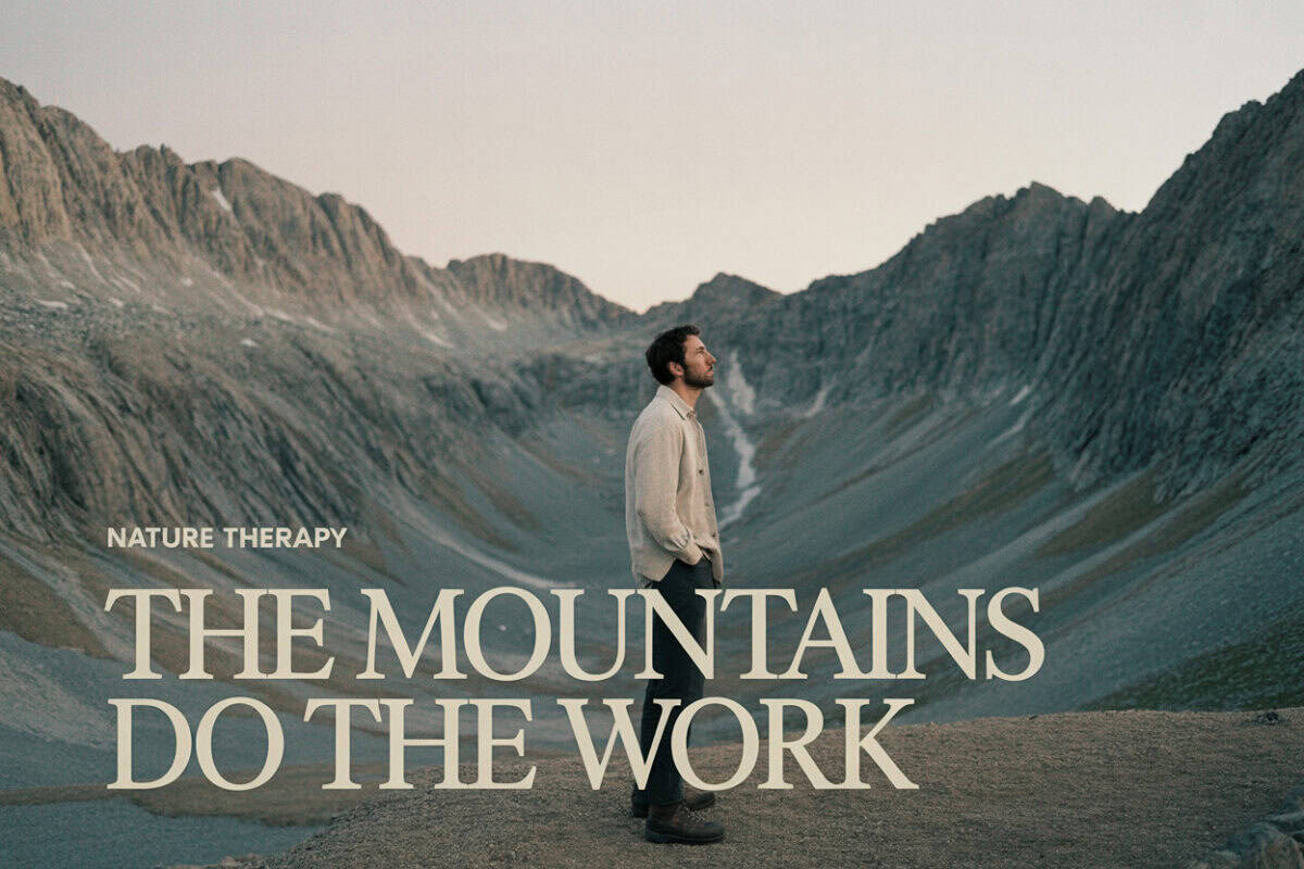 Man standing in mountain valley for nature therapy and recovery.